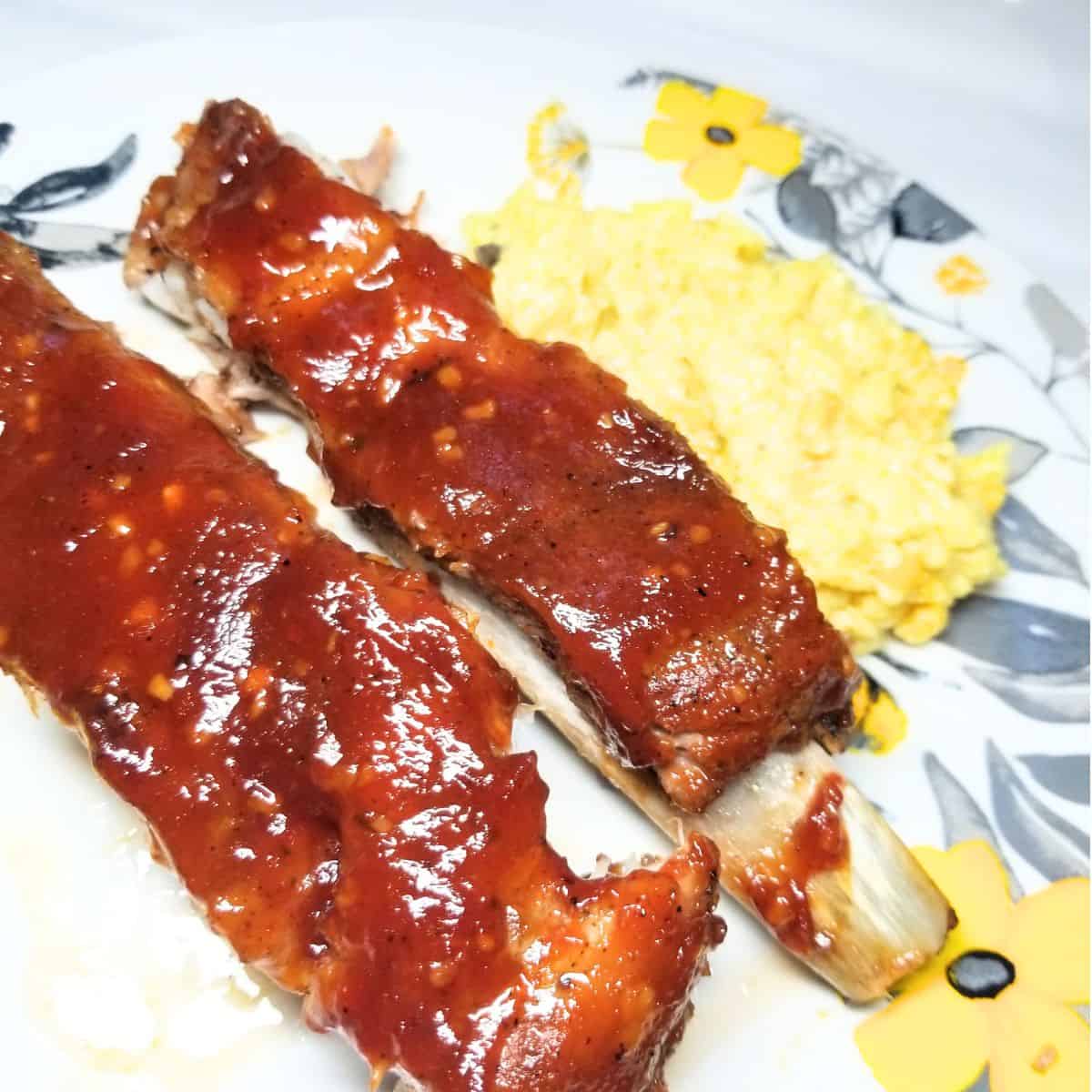 BBQ ribs on a serving plate with rice.
