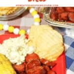 BBQ Sausage on a plate with other sides for a complete meal.