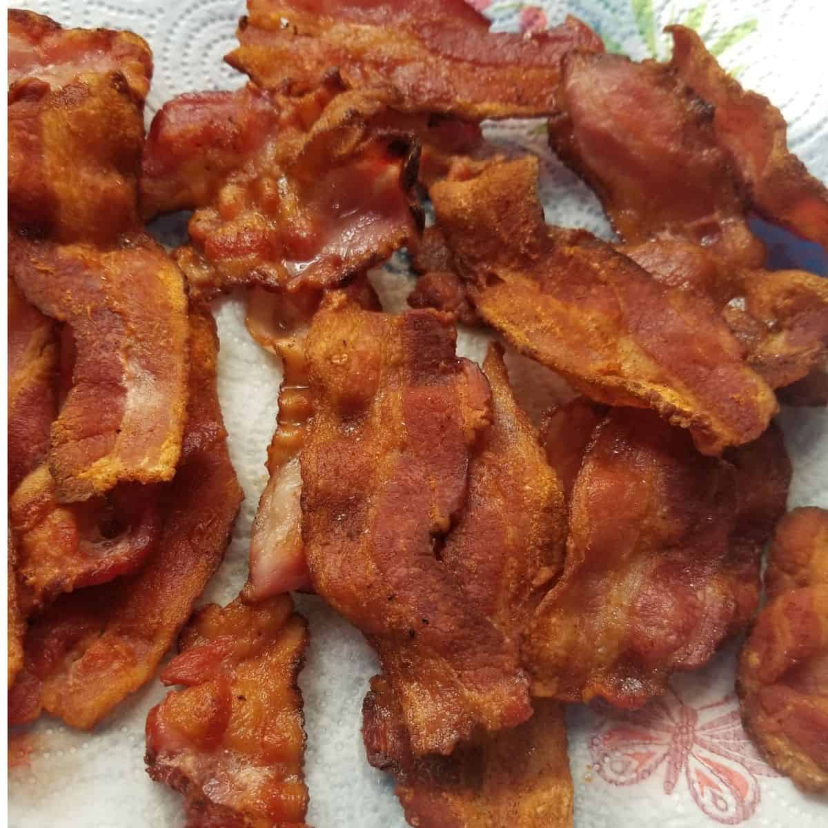 Cooked bacon on a plate.