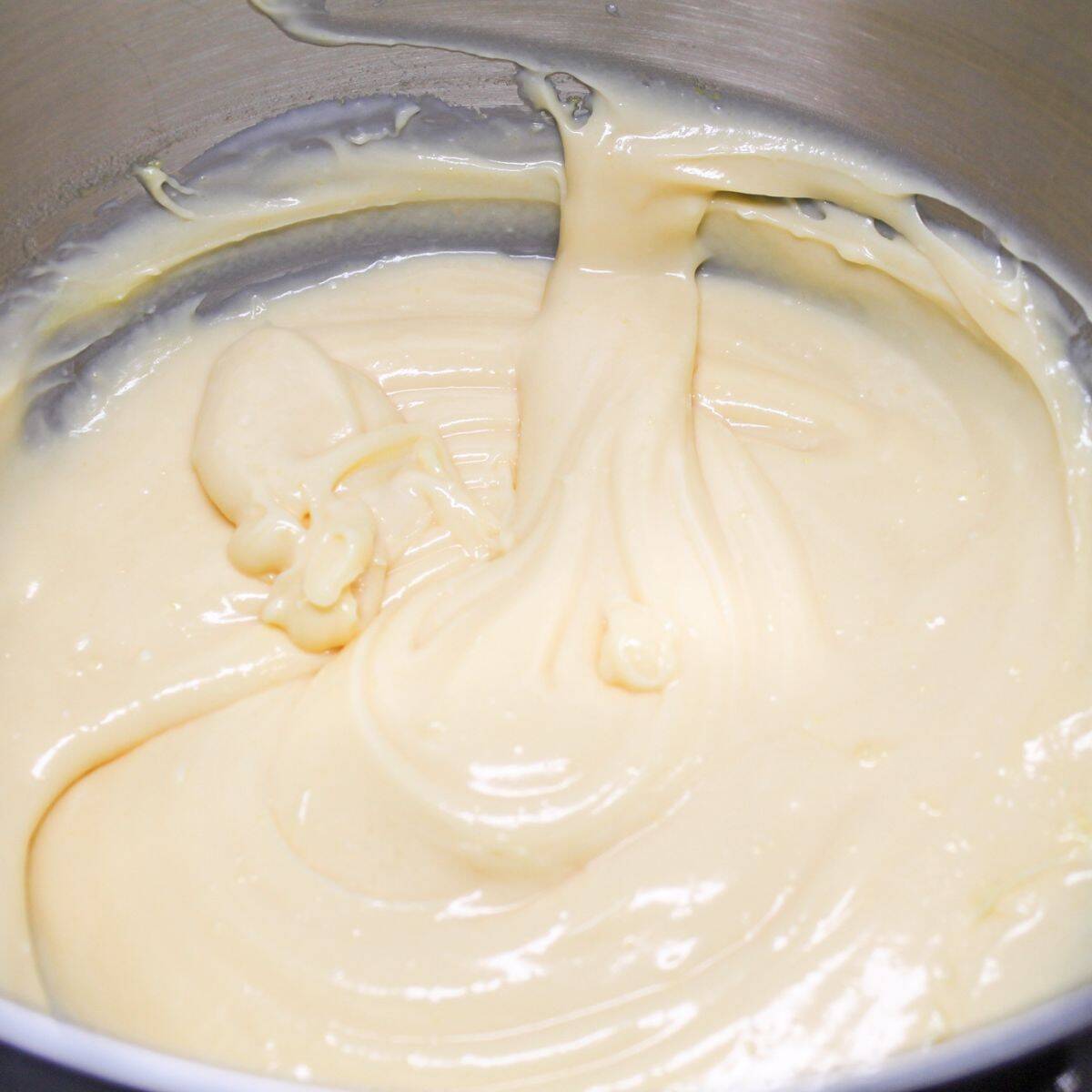 Mixing the creamy layer for the pudding.