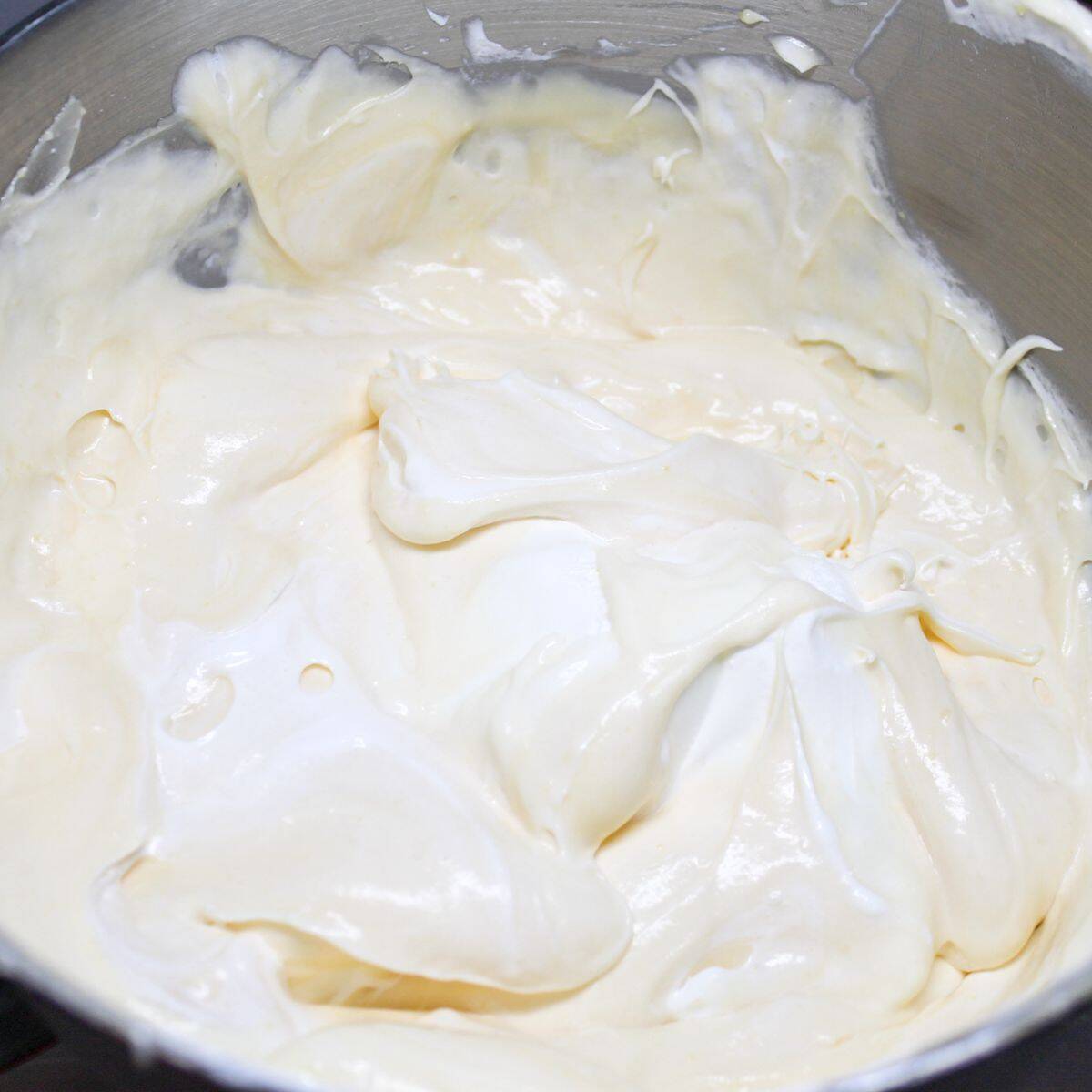 Combining the layers in a mixing bowl for the pudding.