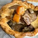 Mini beef pot pie in a white bowl.