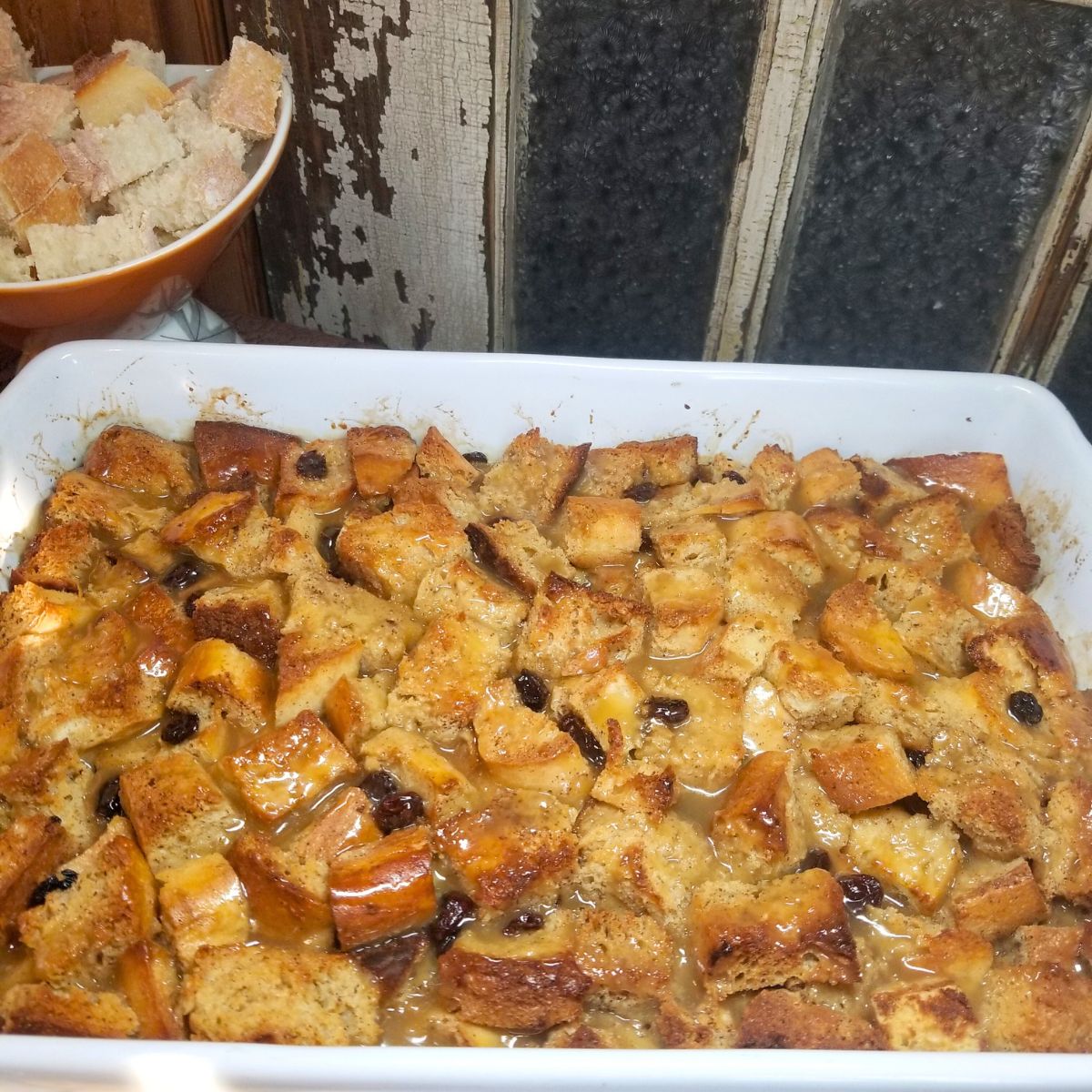 Golden brown bread pudding baking in the oven.