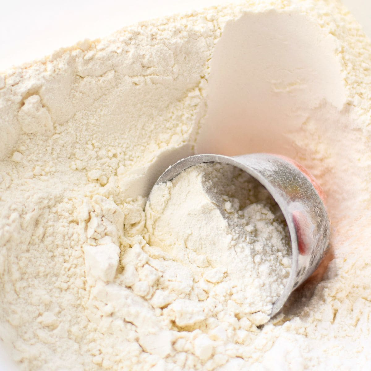 Add flour to the cooked vegetables.
