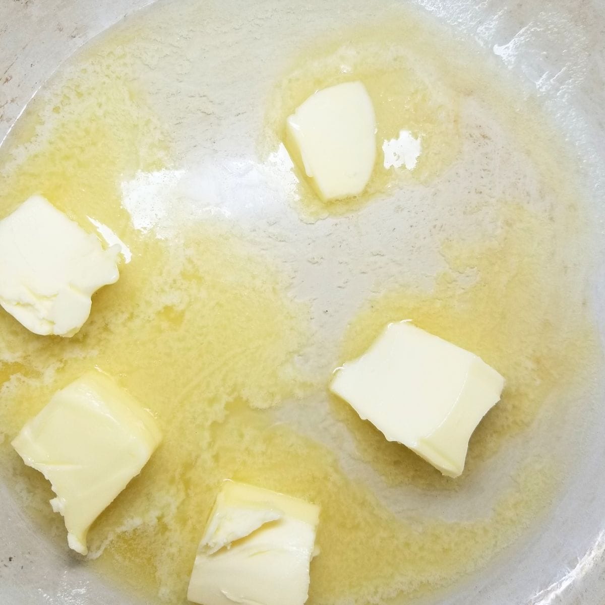 Melted butter and oil in a soup pot.