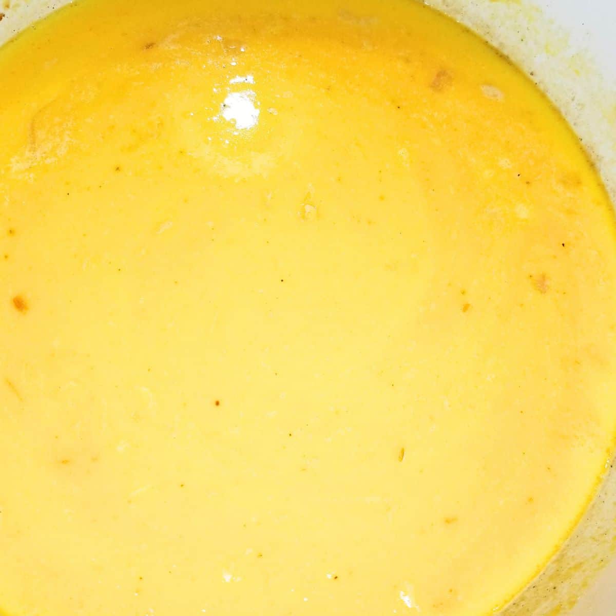 Add milk and heavy cream to the soup pot.