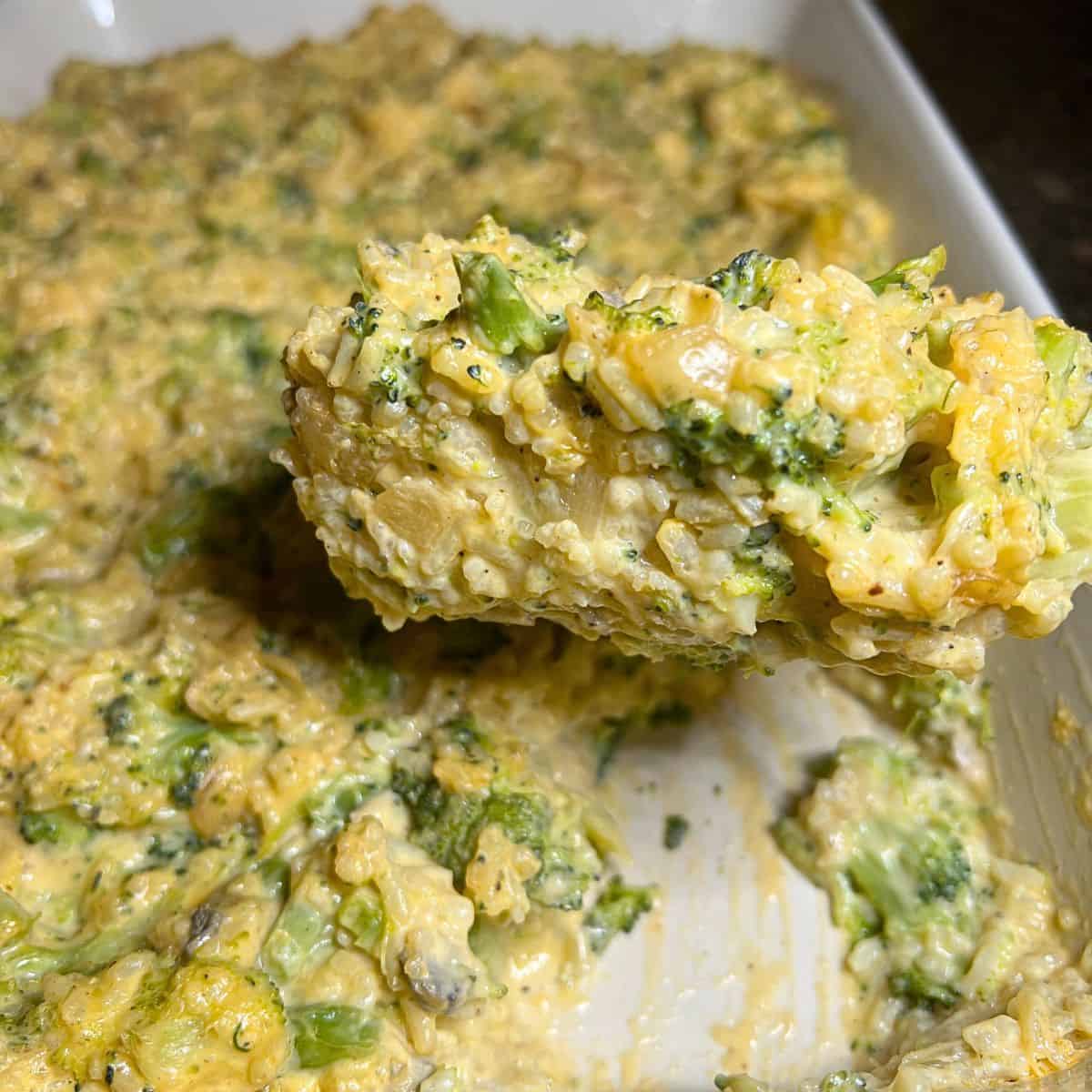 Cooked and ready to serve broccoli and rice casserole  in a baking dish.
