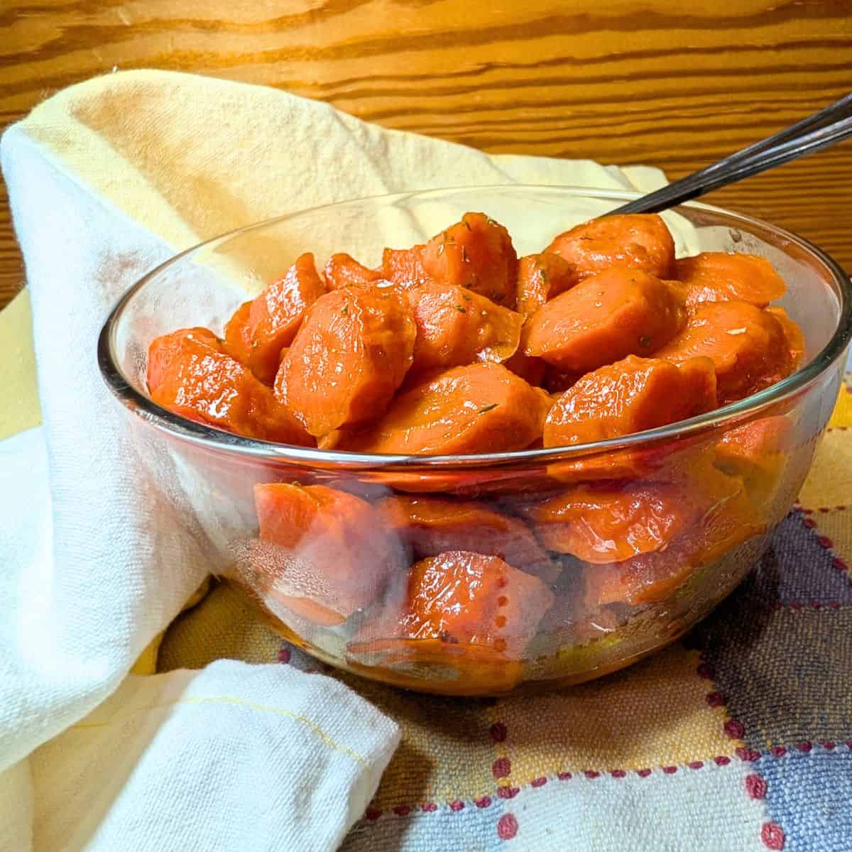 Cooked glazed carrots in a serving bowl.