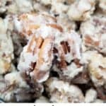 Candied pecans in a bowl with text overlay.