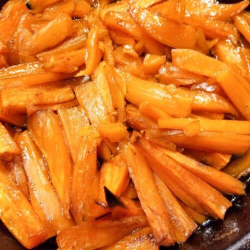 Sweet potatoes cooked in a cast iron skillet.