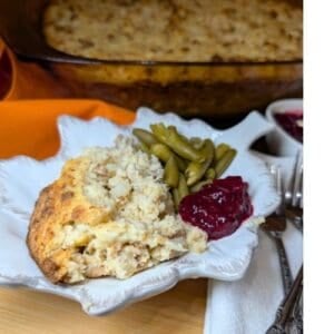 Chicken and Dressing on a serving dish and baking dish.