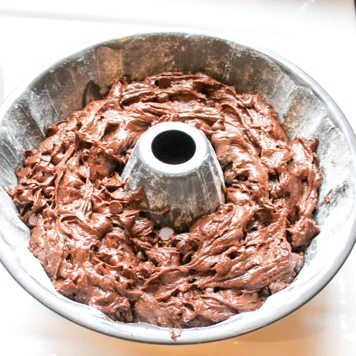 Adding the cake mix to a Bundt pan.