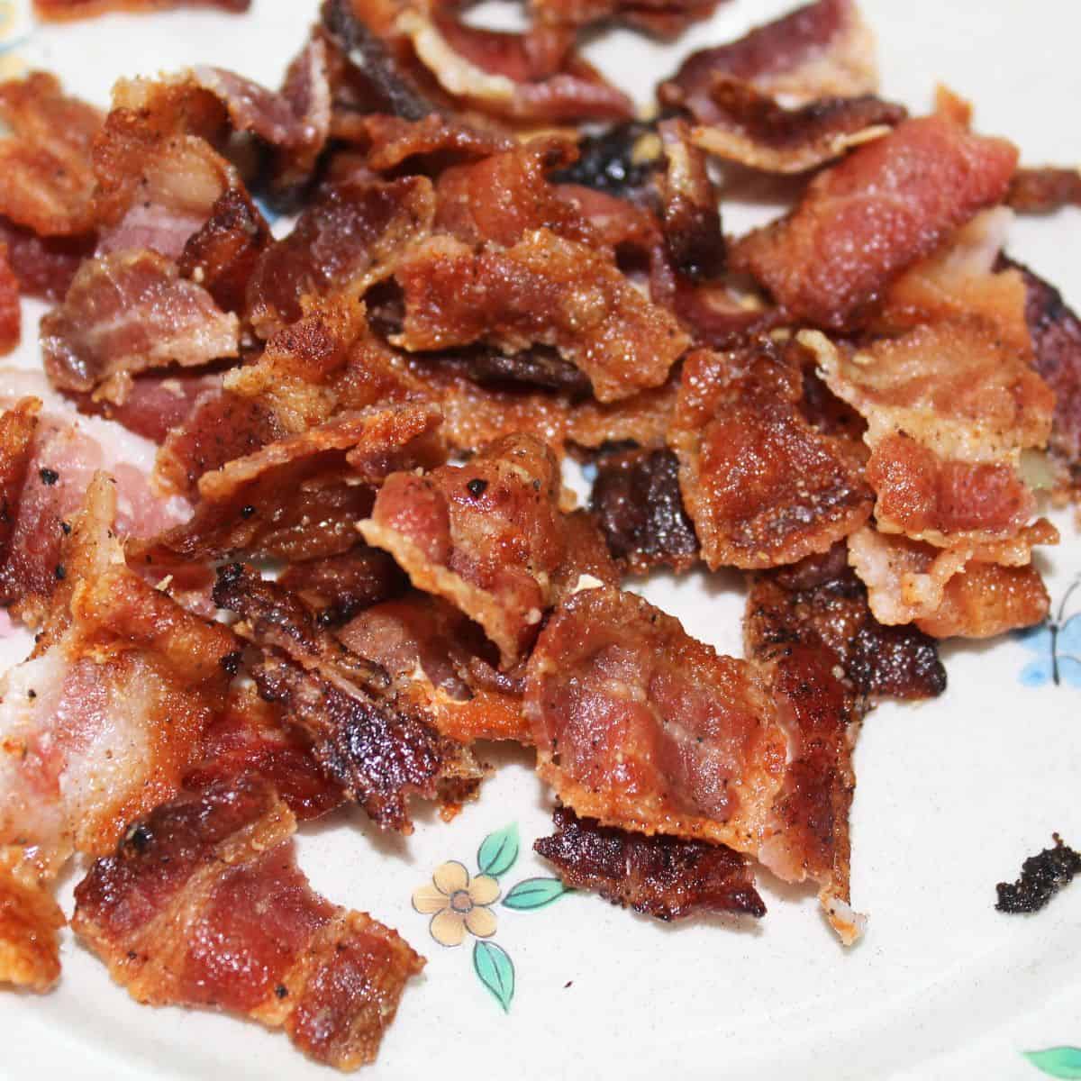 Cooked bacon on a plate.