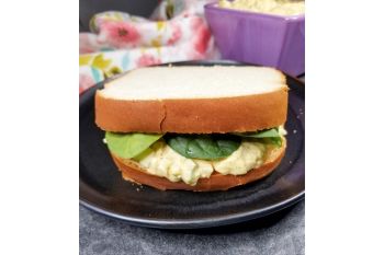 Southern Style Egg Salad Sandwich on a black plate.