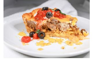 Easy Frito Taco Pie on a white plate.