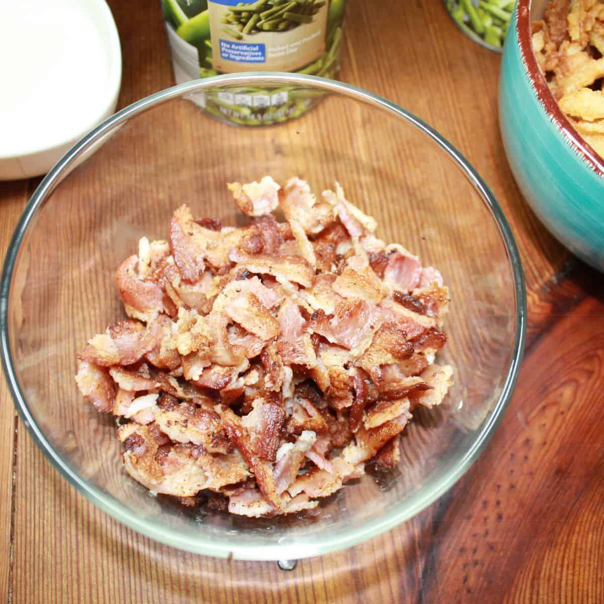 Cooked and crumbled bacon in a bowl.