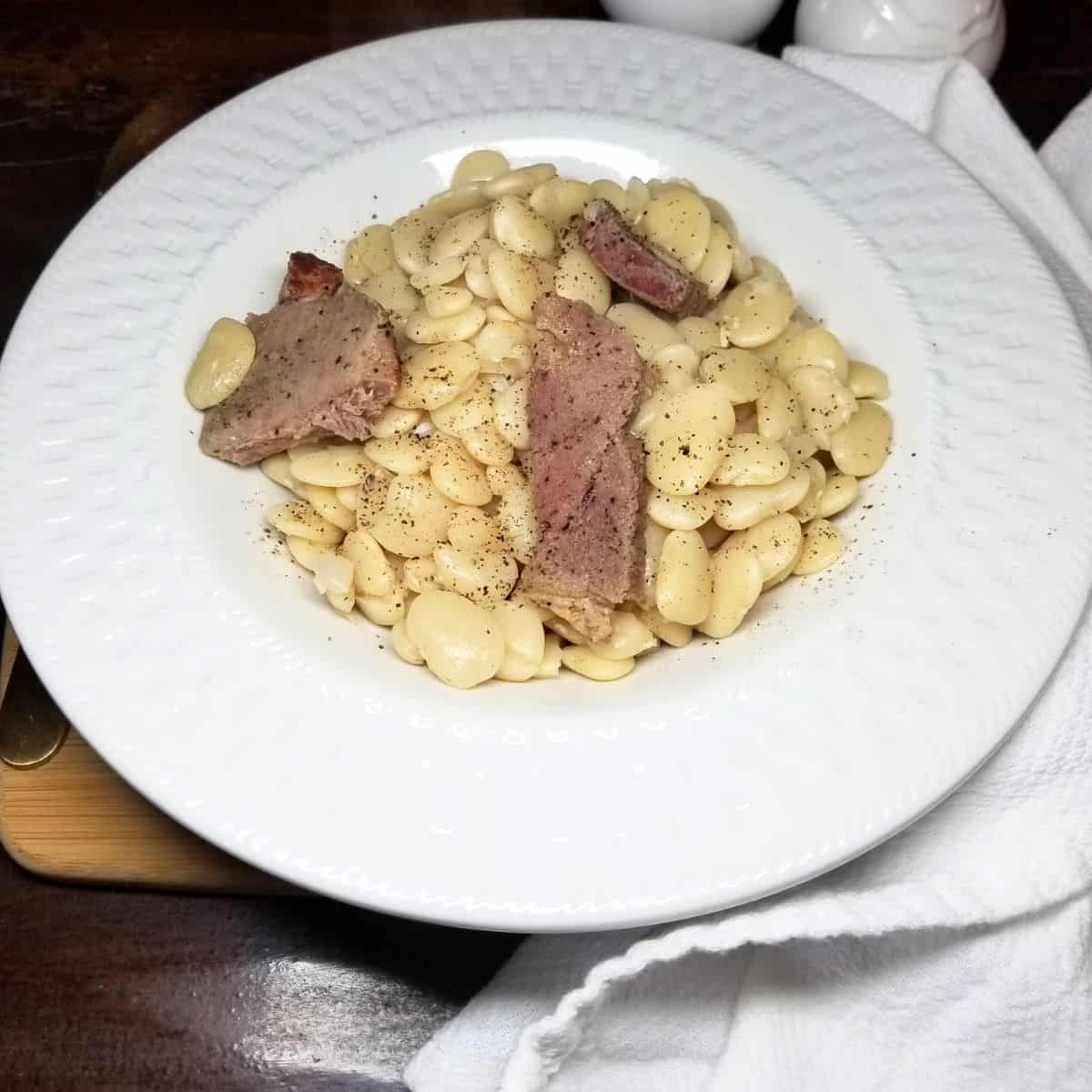 Hearty ham and beans made with dried lima beans ready for dinner.