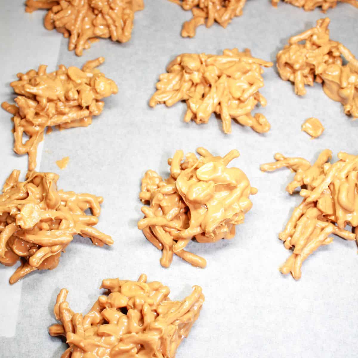 Haystacks cooling on parchment paper.