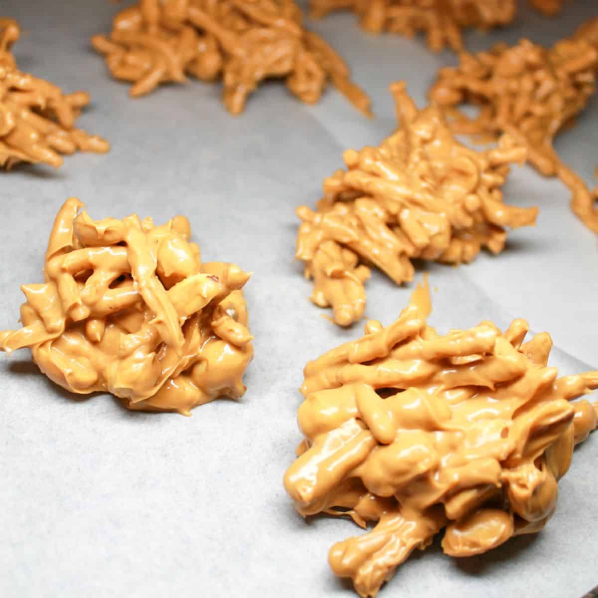 Haystack candy cooling on parchment paper.