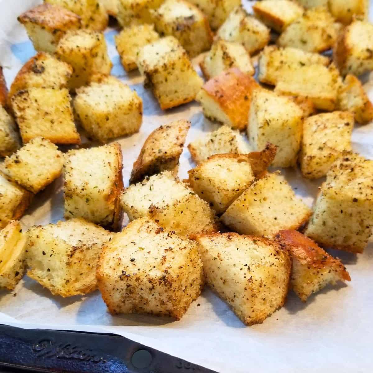 Baked croutons on a baking sheet.