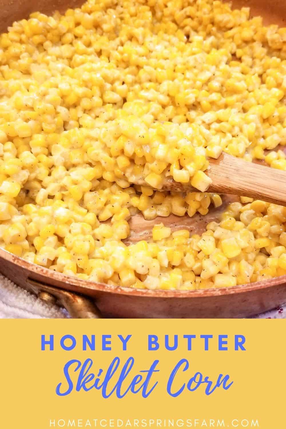 Honey butter skillet corn in a skillet with a spoon with text overlay.