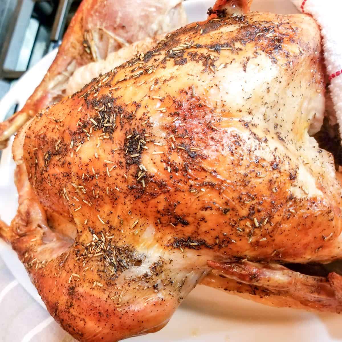 Learn how to cook a turkey in a bag. Cooked turkey on a platter.