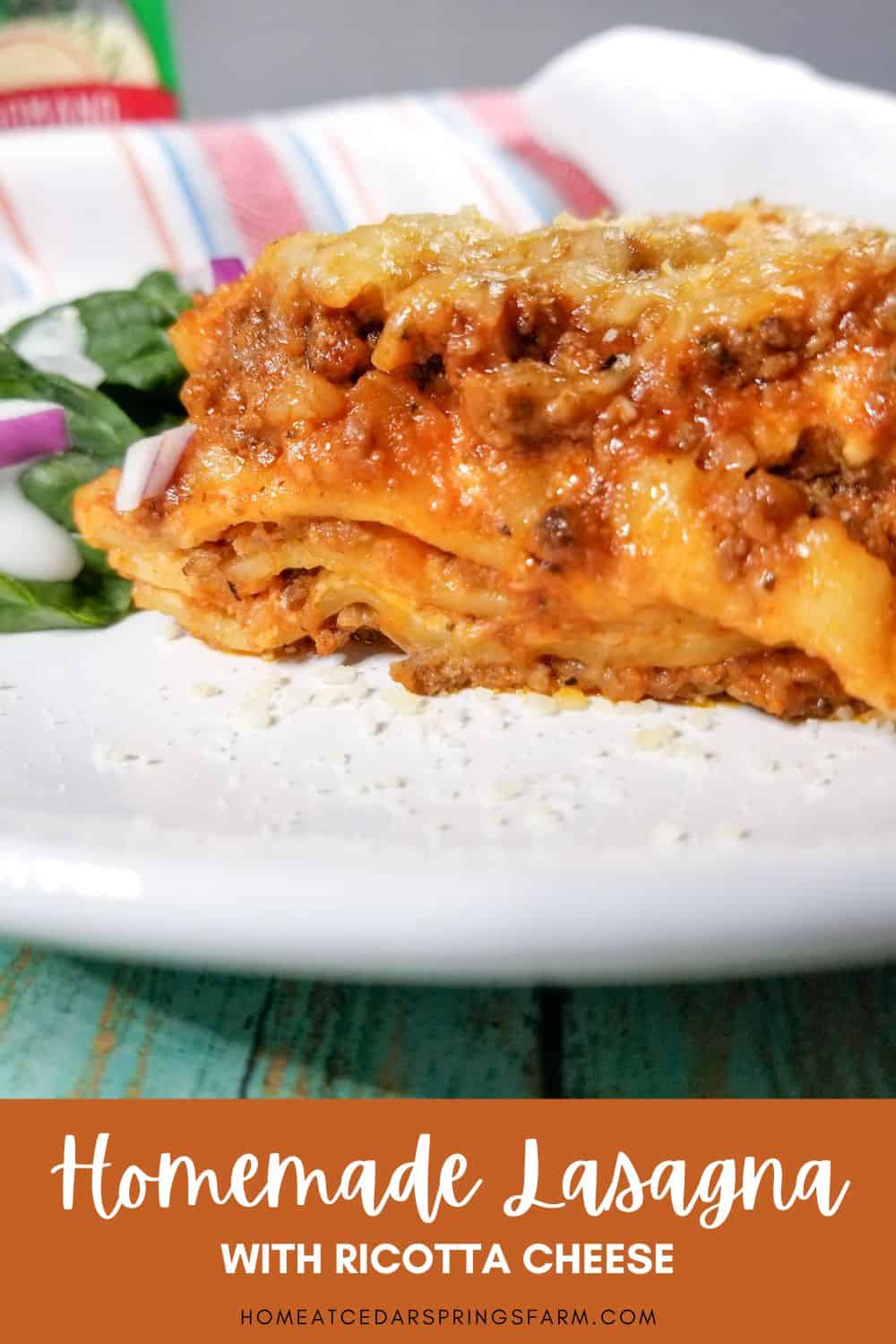 Easy Homemade Lasagna with Ricotta Cheese on a plate with a salad and text overlay.