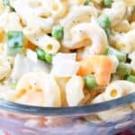 Macaroni Salad with Peas and Cheese in a serving bowl with text overlay.