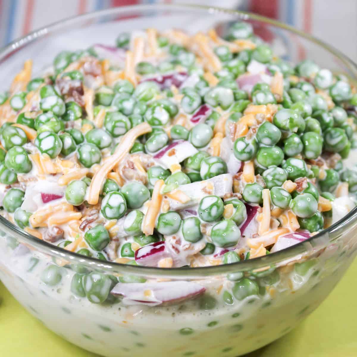 Easy English Pea Salad in a clear serving bowl.