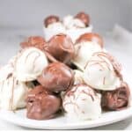 Peanut Butter Balls on a white serving plate.