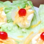 Pear Salad on a platter with lettuce leaves.