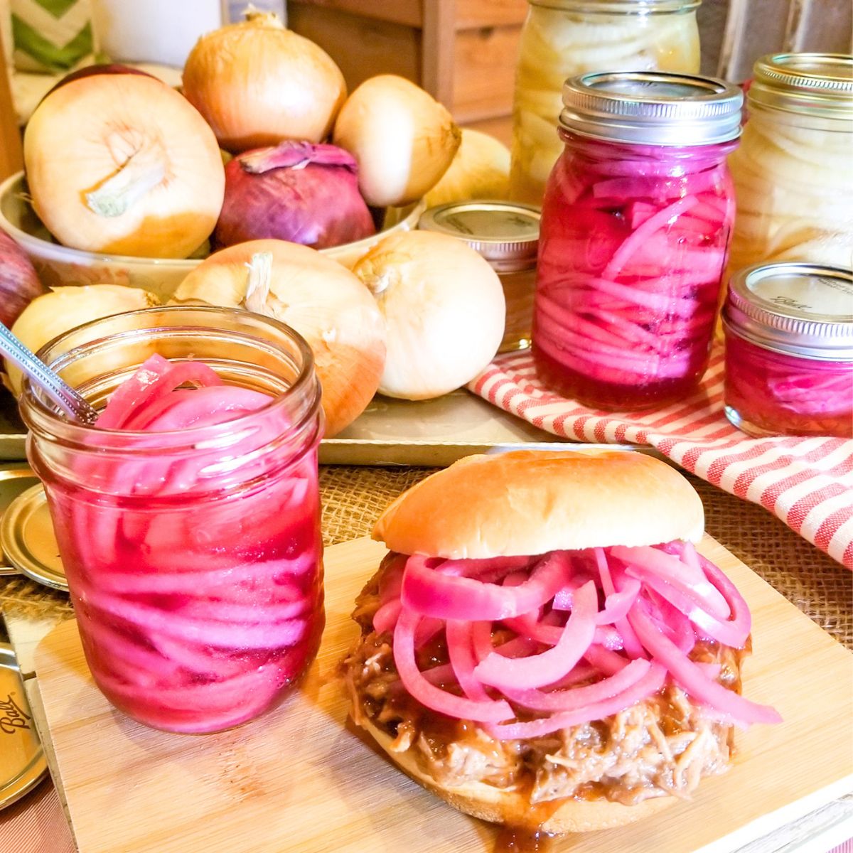 Pickled onions in jars and on a sandwich.
