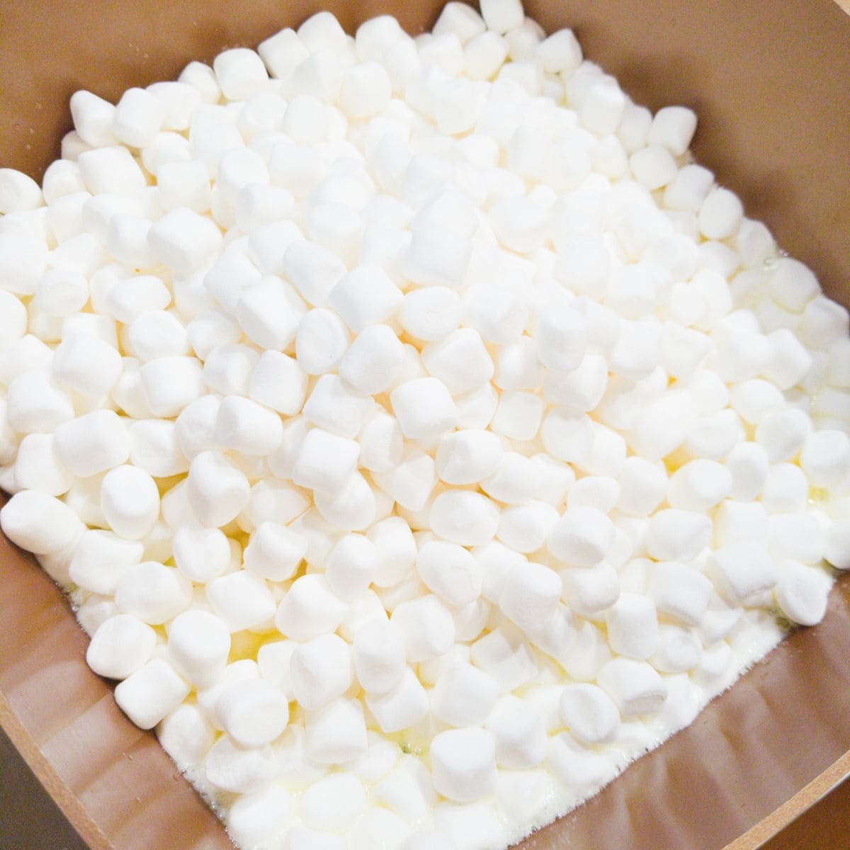 Melting marshmallows in a pot.