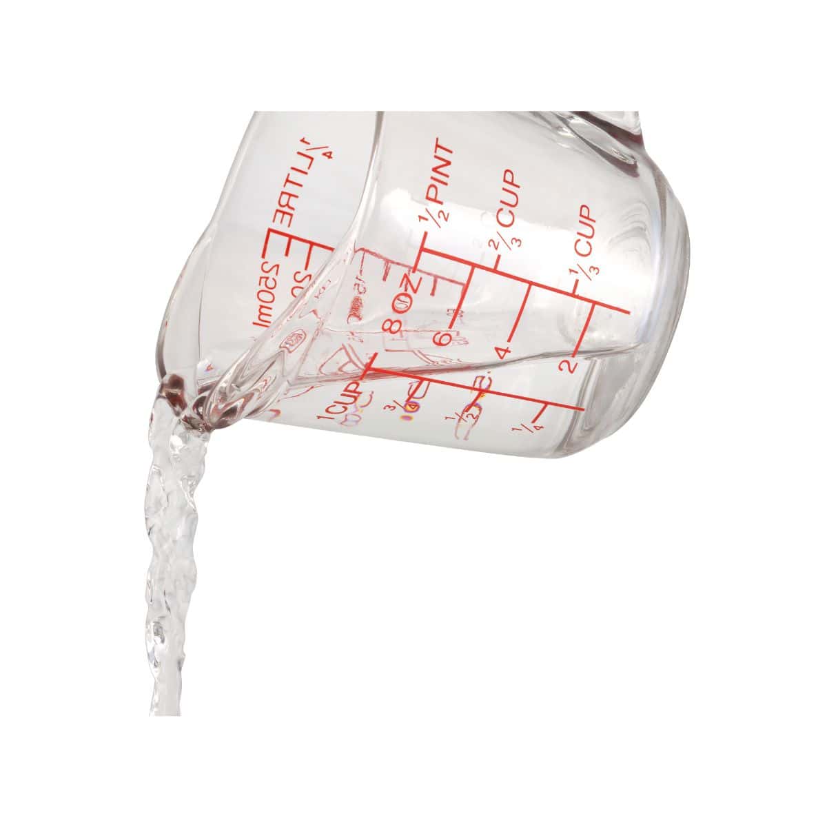 A measuring cup with water being poured out.