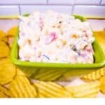 Creamy Ranch Poolside Dip in a green bowl with chips on the side.