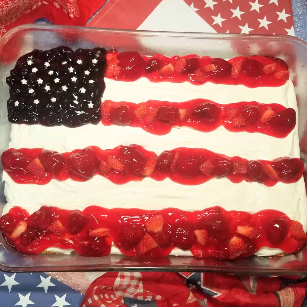 Adding strawberry and blueberry pie filling to create an American flag cheesecake design.
