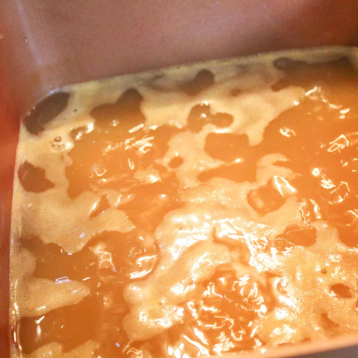 Broth boiling in a pan.