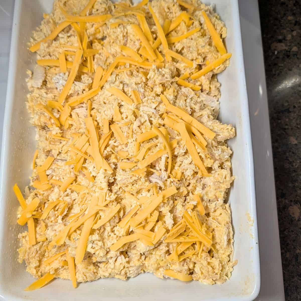 Creamy Chicken Rice-A-Roni Casserole with cheddar cheese on top.