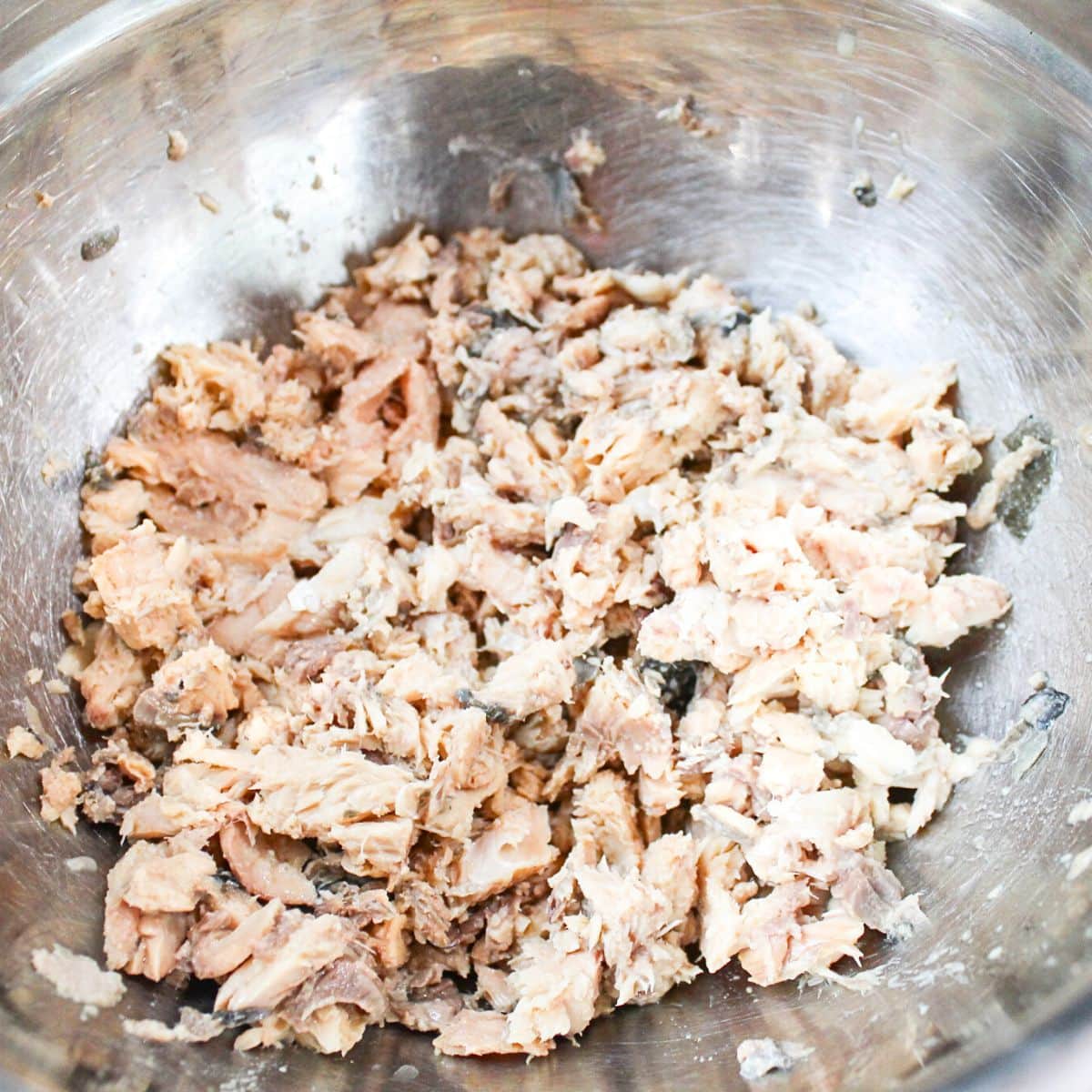 Canned salmon in a bowl.