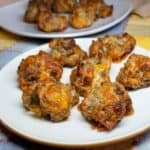 Sausage balls on a serving plate and platter.