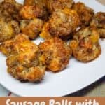 Sausage balls on a white plate with text overlay.
