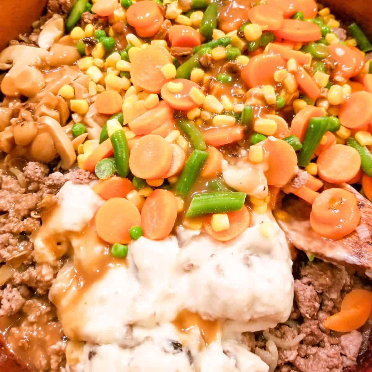 The ingredients being mixed together in a baking dish.