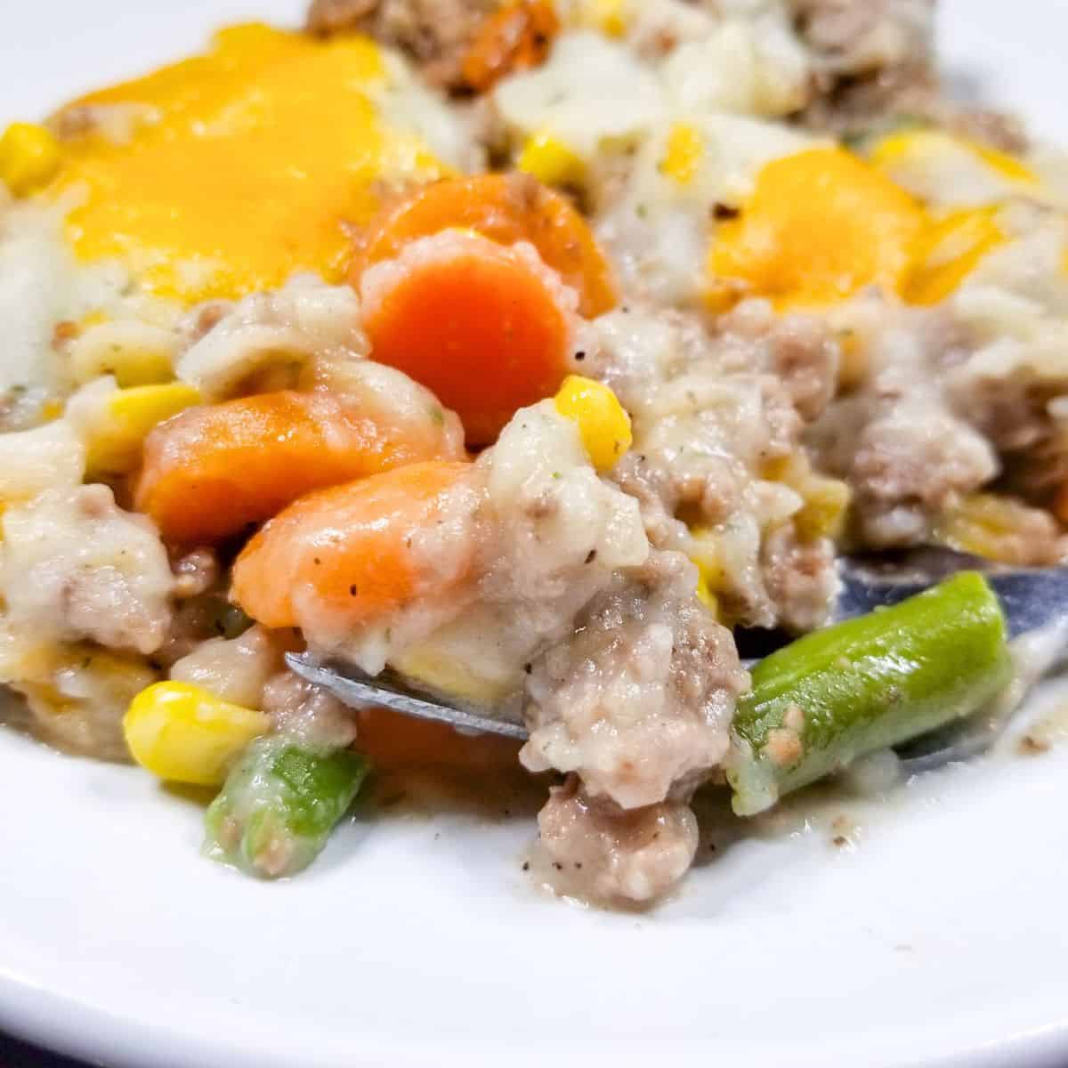 Shepherd's pie on a white plate.