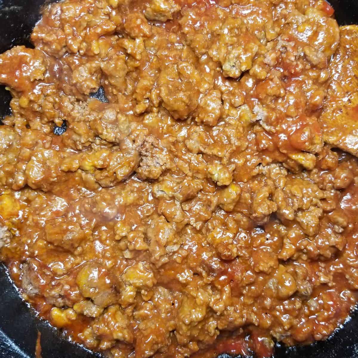 Close up of sloppy joe filling with seasoned ground beef in tangy homemade sauce.