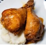 Cooked chicken served in a white dish with text overlay.