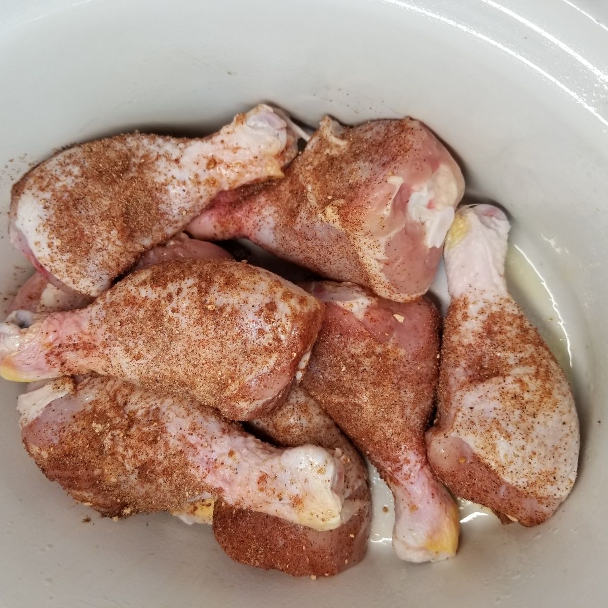 Seasoned chicken in a slow cooker.