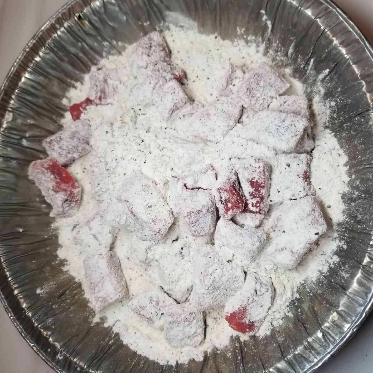 Stew beef coated in flour.