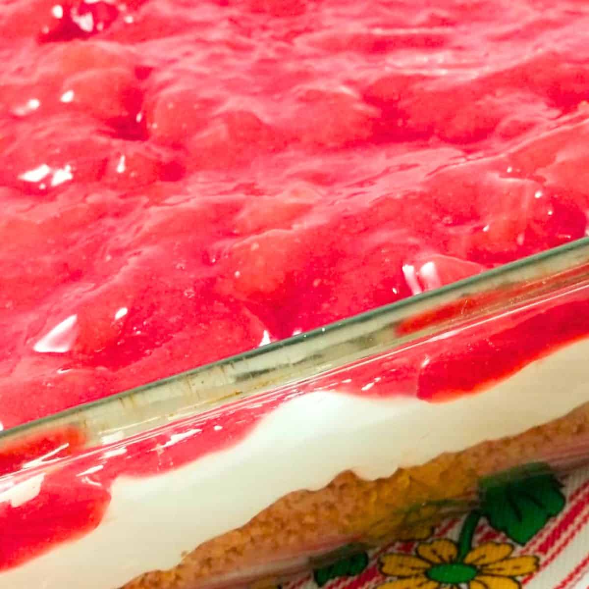 Strawberry dessert bars in a 9x13 baking dish ready to serve.