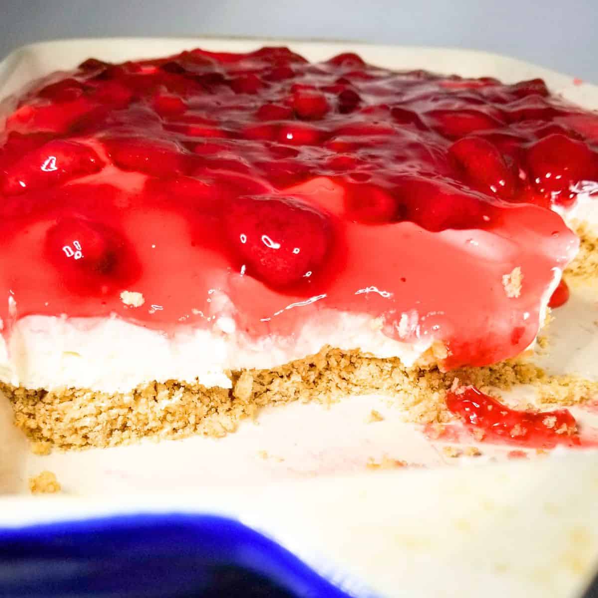 Strawberry dessert bars in a 9x13 baking dish ready to serve.