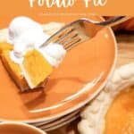A slice of sweet potato pie with whipped cream on a brown plate with a fork.